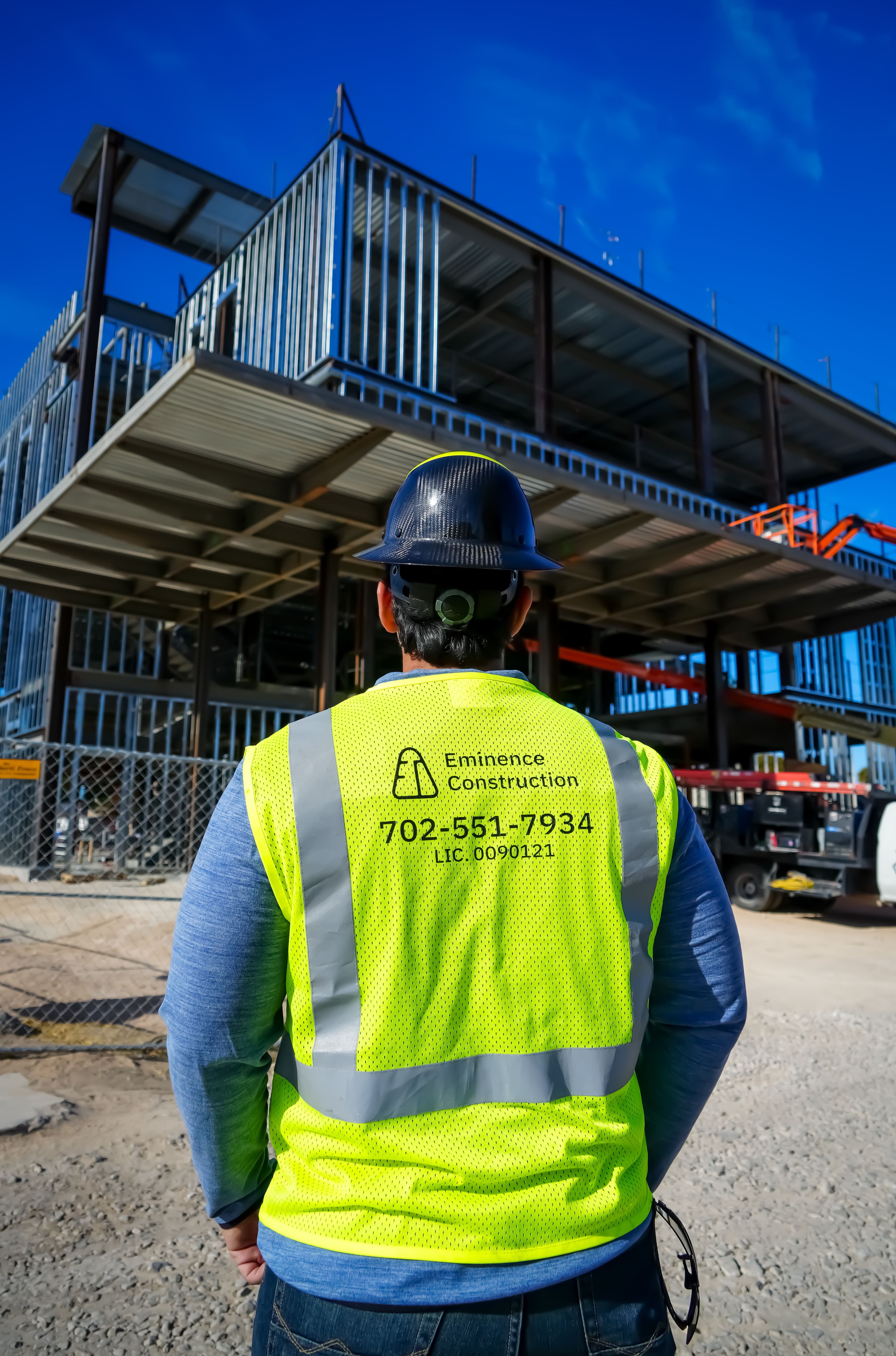 A villa with a pool on a cloudless day.